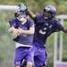 A Pioneer High School football player breaks up a pass during the first day of practice on Monday, August 12, 2013. Melanie Maxwell | AnnArbor.com